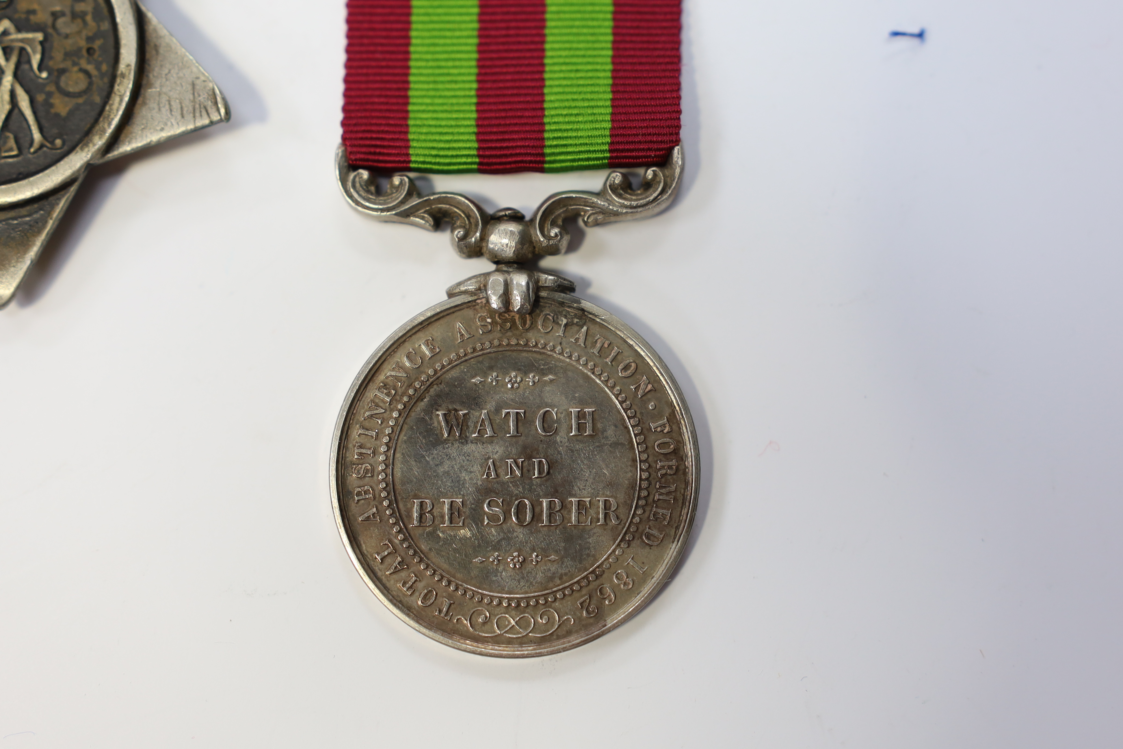 Replica medals; Khedive's Star 1884-6 and another undated; Ashanti star; Spink British North Borneo medal, a loose North West Frontier 1930-31 clasp and a Total Abstinence India medal 50-80